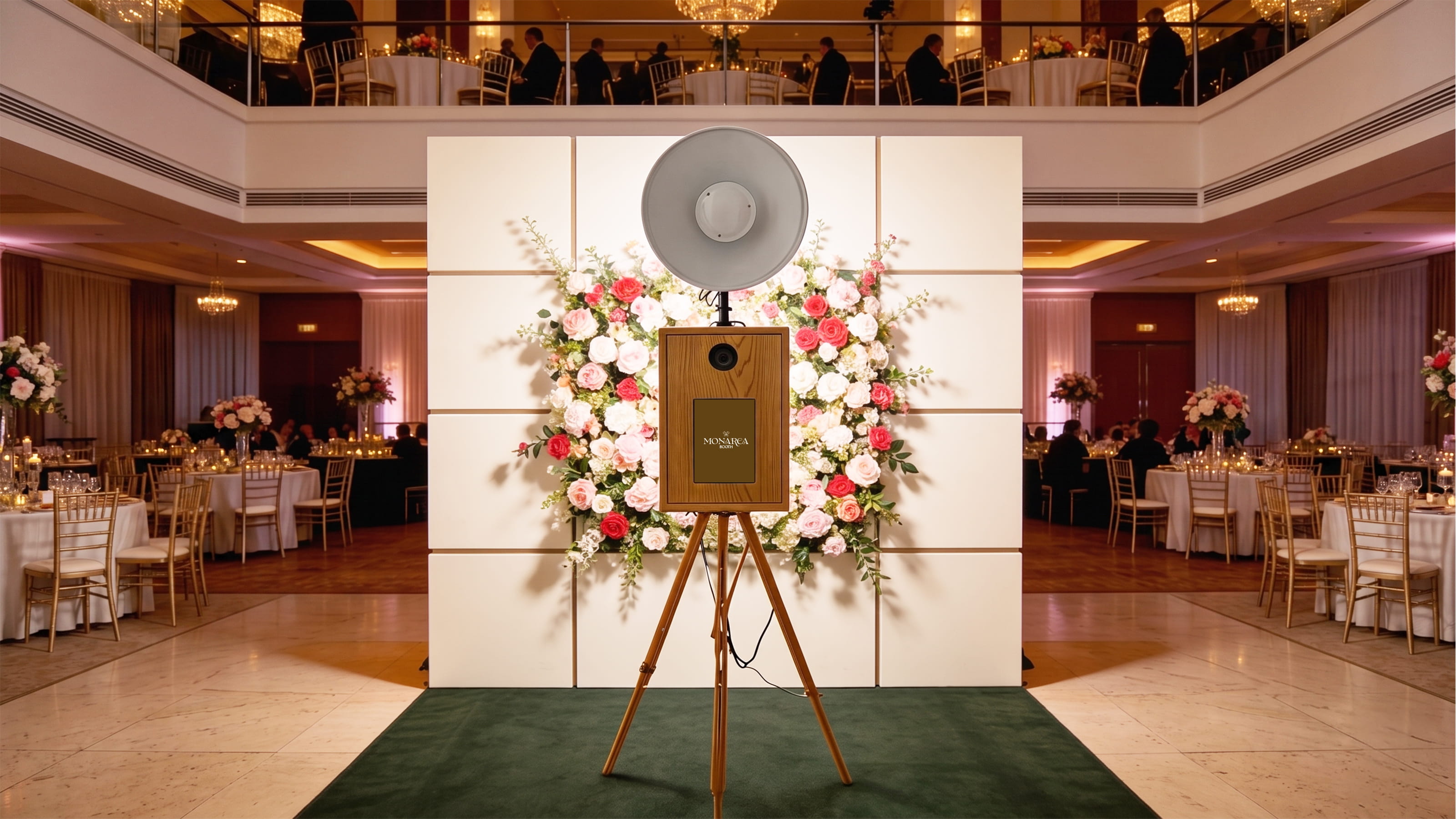 Monarca booth styled with florals at an evening gala